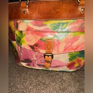 Bright and Vibrant leather handbag with floral design.